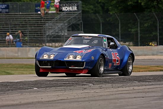 Dark Blue, Racing corvette on track, vintage Chevrolet Corvette at speed.